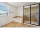 The bathroom features tile flooring, a glass shower enclosure and a soaking tub near a window at 2542 N Riley Rd, Buckeye, AZ 85396