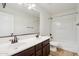 Bathroom featuring dual sink vanity, toilet and a tub-shower combination at 2542 N Riley Rd, Buckeye, AZ 85396