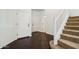 Inviting entryway with hardwood flooring, a staircase, and a view of the front door at 2542 N Riley Rd, Buckeye, AZ 85396