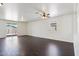 Bright and airy living space with wood-look flooring and a sliding glass door that leads to the outdoor space at 2542 N Riley Rd, Buckeye, AZ 85396