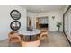 Breakfast nook with travertine tile, round marble table, leather chairs, and large windows at 4531 E Quartz Mountain Rd, Paradise Valley, AZ 85253
