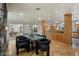 Elegant dining area with wood floors, stylish seating for six, and seamless access to the kitchen at 4531 E Quartz Mountain Rd, Paradise Valley, AZ 85253