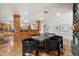 Stylish dining area with seating for six, wood floors, and an open layout connecting the kitchen and living spaces at 4531 E Quartz Mountain Rd, Paradise Valley, AZ 85253