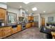 Spacious kitchen with skylight, granite counters, stainless steel appliances, and custom wood cabinetry at 4531 E Quartz Mountain Rd, Paradise Valley, AZ 85253