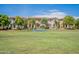 Community baseball field with grassy area and homes in background at 4718 E Thunderheart Trl # 103, Gilbert, AZ 85297