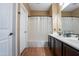 Clean bathroom with dark brown vanity, shower, and tub at 4718 E Thunderheart Trl # 103, Gilbert, AZ 85297