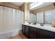 Bathroom with dark brown vanity, shower, and tub at 4718 E Thunderheart Trl # 103, Gilbert, AZ 85297