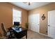 Bright bedroom with a home office and closet at 4718 E Thunderheart Trl # 103, Gilbert, AZ 85297