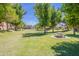 Picnic table in a grassy park area with large trees at 4718 E Thunderheart Trl # 103, Gilbert, AZ 85297