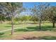 Park with a scenic walking path and benches under trees at 4718 E Thunderheart Trl # 103, Gilbert, AZ 85297