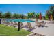 Relaxing pool area with patio furniture and a grilling station at 4718 E Thunderheart Trl # 103, Gilbert, AZ 85297