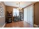 Bright dining room with hardwood floors and decorative shelving at 4718 E Thunderheart Trl # 103, Gilbert, AZ 85297