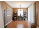 Bright dining room with hardwood floors and decorative shelving at 4718 E Thunderheart Trl # 103, Gilbert, AZ 85297