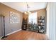 Bright dining room with hardwood floors and decorative shelving at 4718 E Thunderheart Trl # 103, Gilbert, AZ 85297