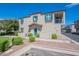 Two-story house with teal front door and well-manicured lawn at 4718 E Thunderheart Trl # 103, Gilbert, AZ 85297