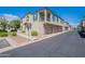 Two-story home with attached garage and front walkway at 4718 E Thunderheart Trl # 103, Gilbert, AZ 85297