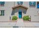 Teal front door entryway with landscaping and walkway at 4718 E Thunderheart Trl # 103, Gilbert, AZ 85297