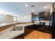 Modern kitchen with dark wood cabinets and stainless steel appliances at 4718 E Thunderheart Trl # 103, Gilbert, AZ 85297