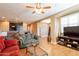 Open living room with hardwood floors and access to kitchen at 4718 E Thunderheart Trl # 103, Gilbert, AZ 85297