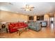 Spacious living room with hardwood floors and comfy sofas at 4718 E Thunderheart Trl # 103, Gilbert, AZ 85297