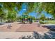 playground with sand, slides, and play equipment at 4718 E Thunderheart Trl # 103, Gilbert, AZ 85297
