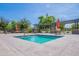 Community spa with surrounding lounge area at 4718 E Thunderheart Trl # 103, Gilbert, AZ 85297