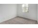 Bright bedroom features carpet floors, neutral paint, large window for natural light at 4918 W Beryl Ave, Glendale, AZ 85302