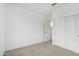 A simple bedroom with carpet floors, neutral walls, a closet, and natural light at 4918 W Beryl Ave, Glendale, AZ 85302
