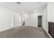 Spacious bedroom with neutral carpet, white walls, and multiple doors leading to other rooms at 4918 W Beryl Ave, Glendale, AZ 85302