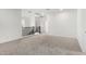 Bright bedroom features neutral carpet, white walls, staircase with railing, and doors to other rooms at 4918 W Beryl Ave, Glendale, AZ 85302