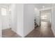 Bright entryway with tile floors and white walls leading to the staircase and living area at 4918 W Beryl Ave, Glendale, AZ 85302
