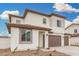 Charming two-story home with neutral colors, a three-car garage, and manicured landscaping at 4918 W Beryl Ave, Glendale, AZ 85302