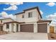 Charming two-story home with neutral colors, a three-car garage, and manicured landscaping at 4918 W Beryl Ave, Glendale, AZ 85302