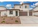 Charming two-story home with neutral colors, a three-car garage, and manicured landscaping at 4918 W Beryl Ave, Glendale, AZ 85302