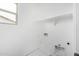 Bright laundry room with a utility sink, shelf, and various hookups at 4918 W Beryl Ave, Glendale, AZ 85302