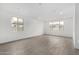 Bright, spacious living room with tile floors and many windows for natural light at 4918 W Beryl Ave, Glendale, AZ 85302