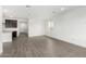 Bright living room featuring sleek wood-look tile floors, recessed lighting, and neutral paint at 4918 W Beryl Ave, Glendale, AZ 85302