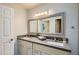 Bathroom with double vanity and a large mirror at 6444 E Paradise Ln, Scottsdale, AZ 85254