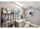 Modern bathroom with a floating vanity, toilet, and stylish shelving at 6444 E Paradise Ln, Scottsdale, AZ 85254
