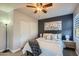 Bright bedroom with a queen-size bed and ceiling fan at 6444 E Paradise Ln, Scottsdale, AZ 85254