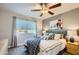 Bedroom with a queen bed, ceiling fan, and city view at 6444 E Paradise Ln, Scottsdale, AZ 85254