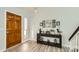Bright entryway with wood floors and a console table at 6444 E Paradise Ln, Scottsdale, AZ 85254