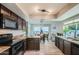 Modern kitchen with granite countertops and dark cabinetry at 6444 E Paradise Ln, Scottsdale, AZ 85254