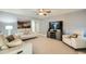 Relaxing living room with comfy sofas, a large TV, and ceiling fan at 6444 E Paradise Ln, Scottsdale, AZ 85254