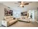 Open living area with two sofas and artwork, leading to hallway at 6444 E Paradise Ln, Scottsdale, AZ 85254