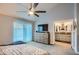 Main bedroom with king bed, dresser, and bathroom access at 6444 E Paradise Ln, Scottsdale, AZ 85254