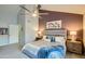 Main bedroom with king bed and access to bathroom; view of additional room at 6444 E Paradise Ln, Scottsdale, AZ 85254