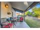 Covered patio with seating area and backyard access at 6444 E Paradise Ln, Scottsdale, AZ 85254