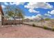 Backyard with pergola, table, and partial view of other houses at 6903 W Irwin Ave, Laveen, AZ 85339