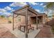 Backyard with pergola, table, and benches at 6903 W Irwin Ave, Laveen, AZ 85339